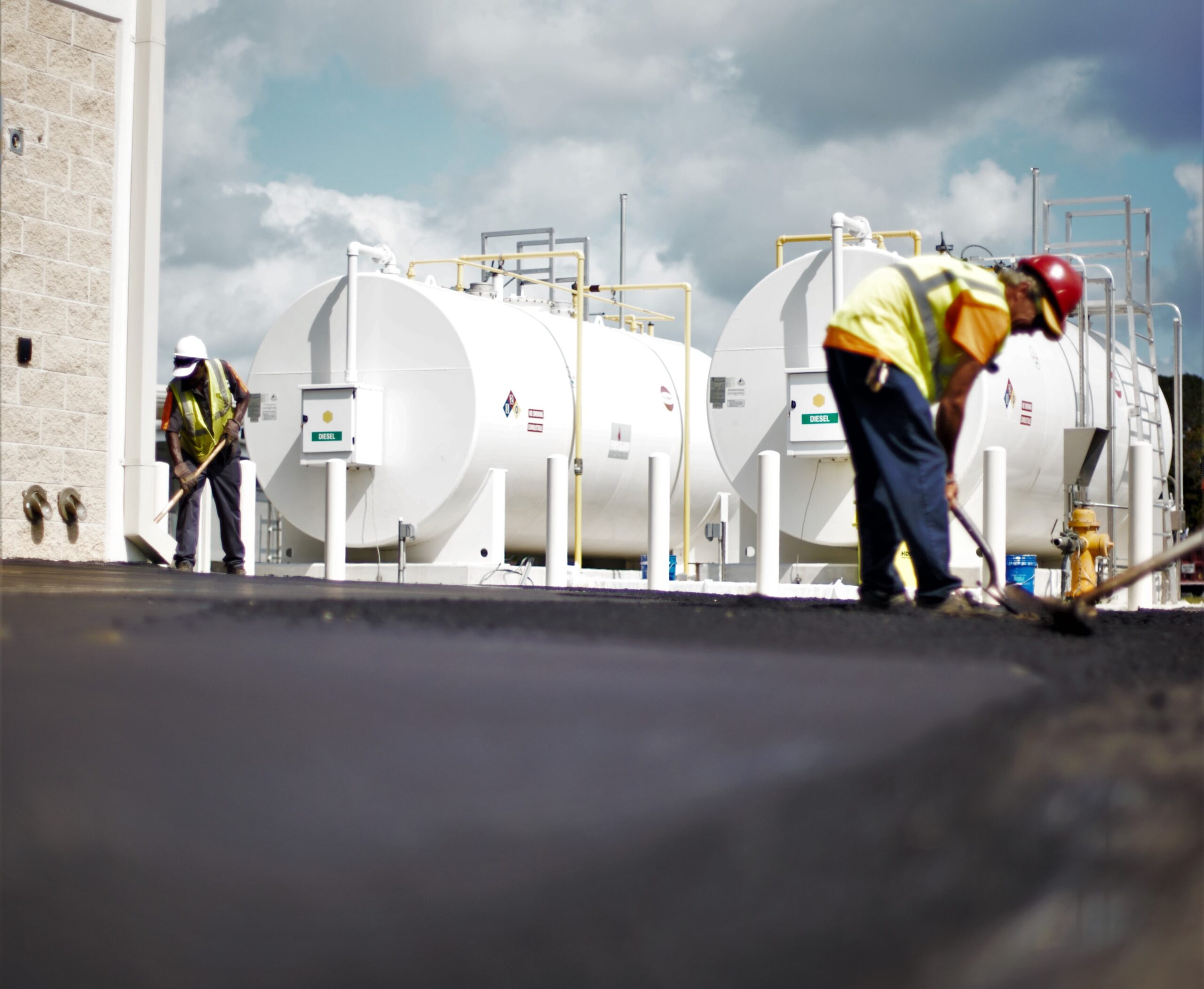 2 men finishing a municipal paving job in South Florida